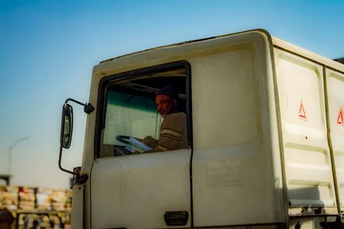 Driver in the cab of a warehouse truck