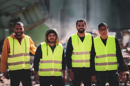 Four Interpac team members in reflective safety vests