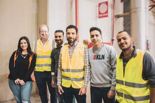 Interpac team members standing together inside the mill
